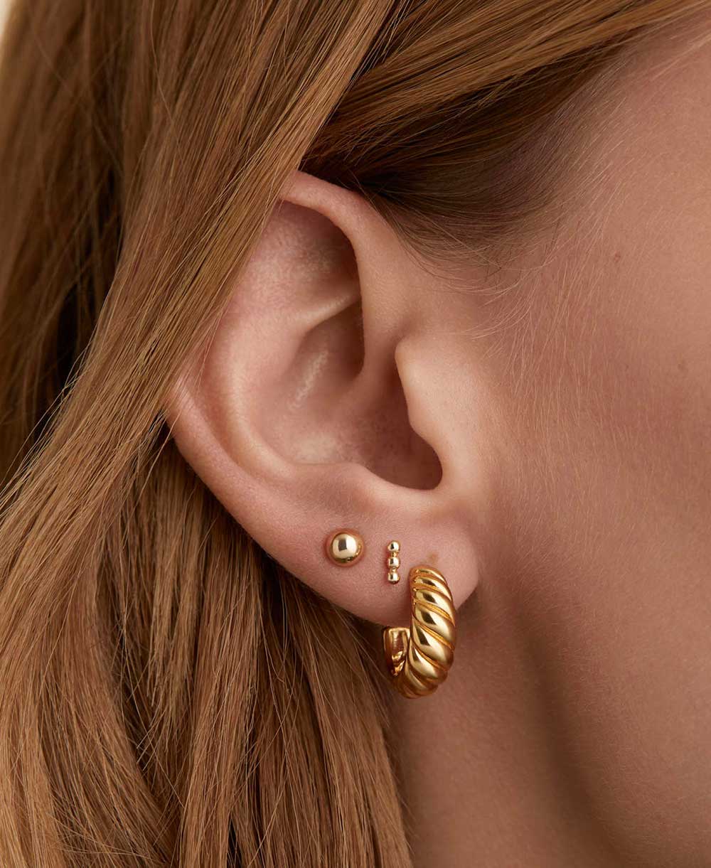 Boucles d’oreilles créoles torsadées dorées